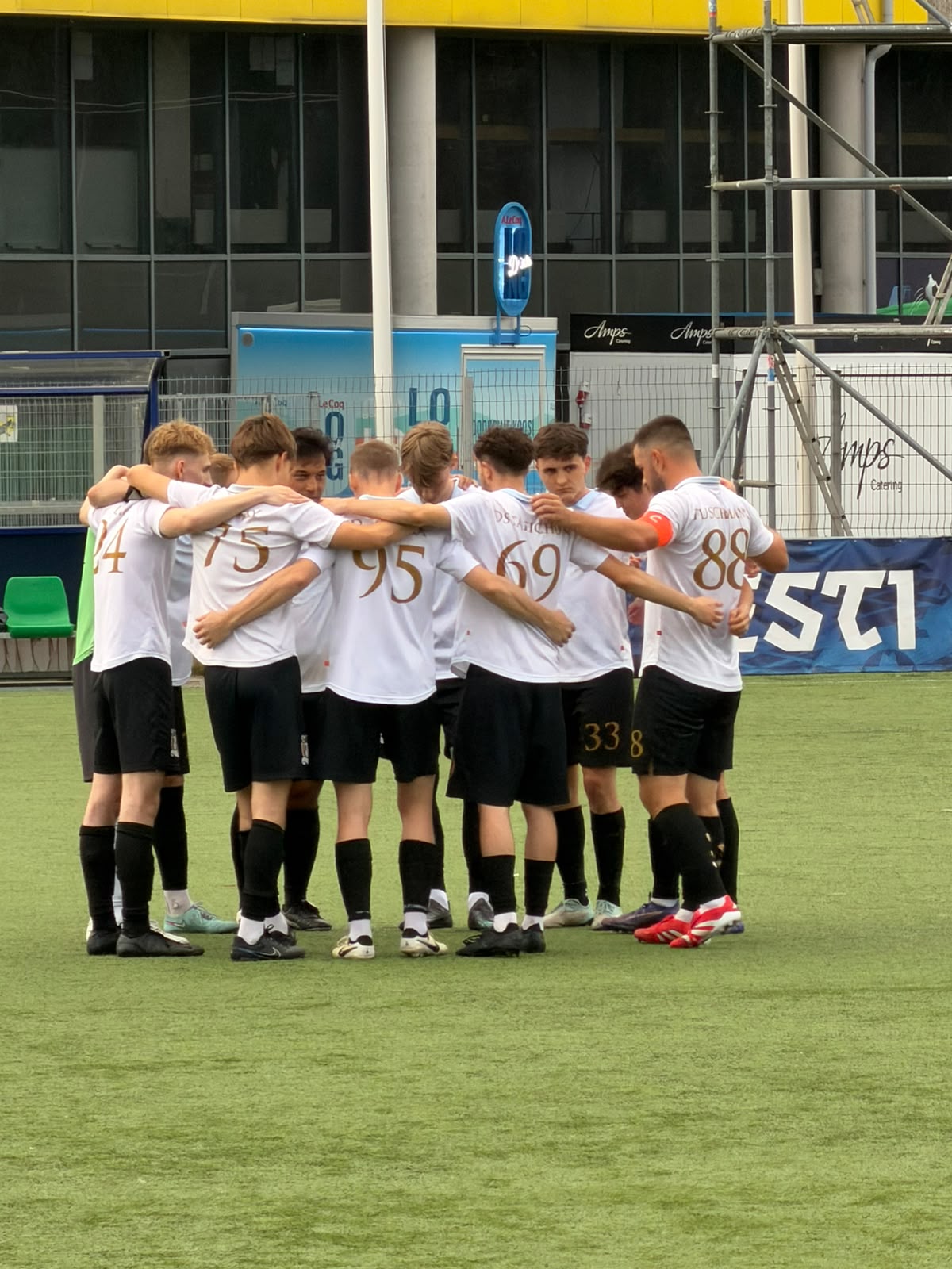 Rumori players in a huddle before a match